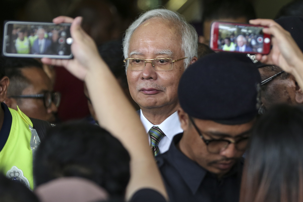 Former prime minister Datuk Seri Najib Razak leaves the Kuala Lumpur High Court after being charged today, August 8, 2018. u00e2u20acu201d Picture by Azneal Ishak