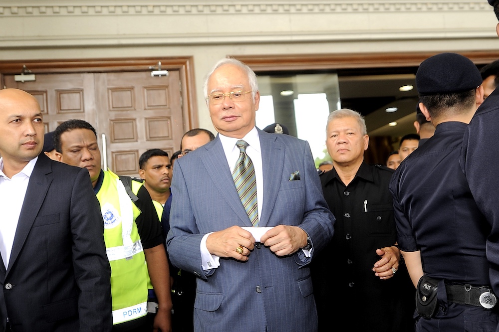 Former prime minister Datuk Seri Najib Razak leaves the Kuala Lumpur High Court after being charged today, August 8, 2018. u00e2u20acu201d Picture by Shafwan Zaidon