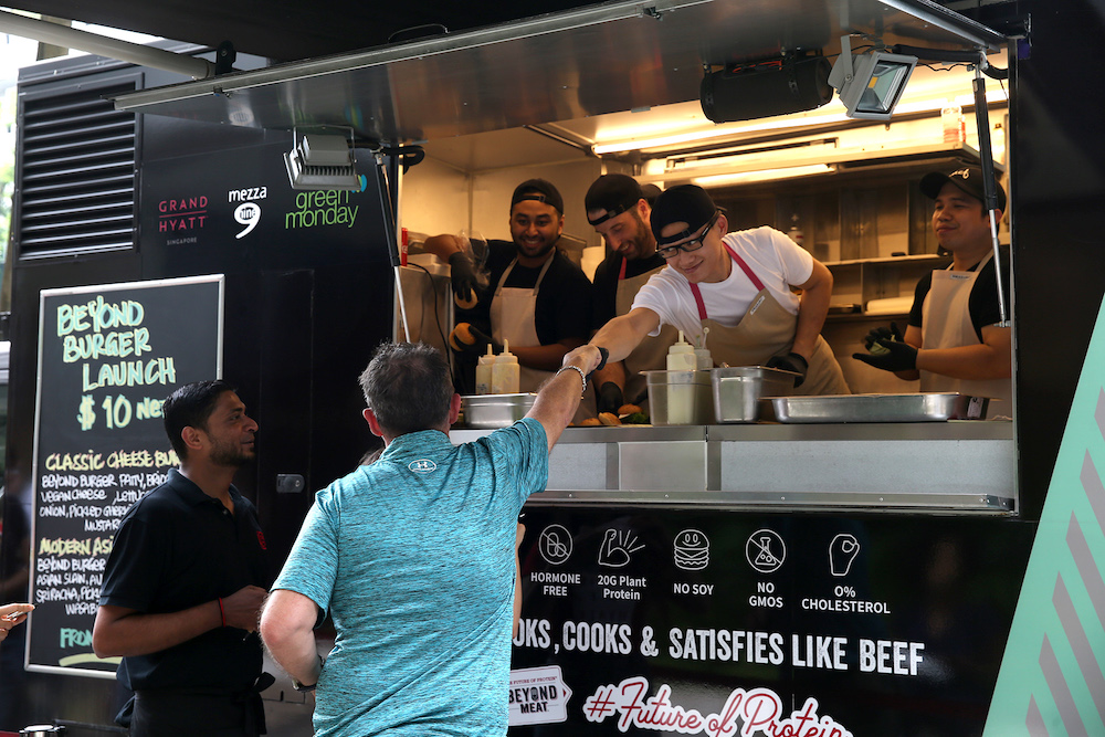 Restaurant mezza9’s food truck located outside the Grand Hyatt Singapore serving the Classic Cheese Burger and the Modern Asian Burger using Beyond Burger plant-based patties. — TODAY pic