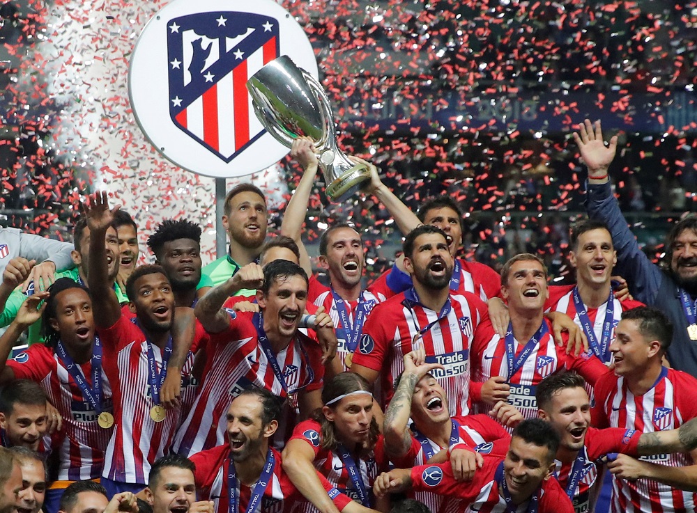 Atletico Madrid celebrate with the trophy after winning the Super Cup at the Lillekula Stadium in Tallinn, Estonia August 15, 2018. u00e2u20acu201d Reuters pic