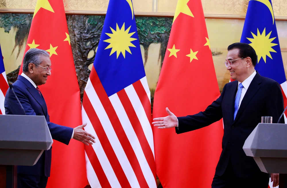 Prime Minister Tun Dr Mahathir Mohamad shakes hands with Chinau00e2u20acu2122s Premier Li Keqiang at the end of a news conference at the Great Hall of the People in Beijing August 20, 2018. u00e2u20acu201d Reuters pic 
