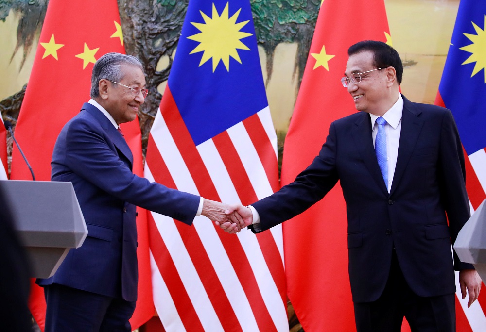 Prime Minister Tun Dr Mahathir Mohamad shakes hands with Chinau00e2u20acu2122s Premier Li Keqiang at the end of a news conference at the Great Hall of the People in Beijing August 20, 2018. u00e2u20acu201d Reuters pic 