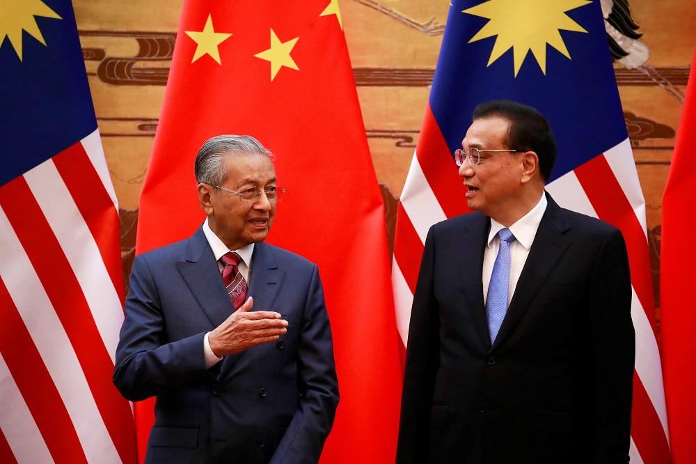 Prime Minister Tun Dr Mahathir Mohamad and Chinau00e2u20acu2122s Premier Li Keqiang speak during their meeting at the Great Hall of the People in Beijing August 20, 2018. u00e2u20acu201d Reuters pic