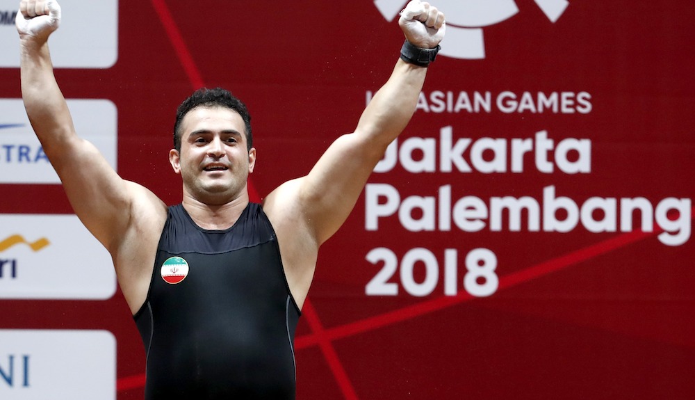 Sohrab Moradi of Iran reacts after breaking the world record in the menu00e2u20acu2122s 94kg class at the 2018 Asian Games in Jakarta August 25, 2018. u00e2u20acu201d Reuters pic