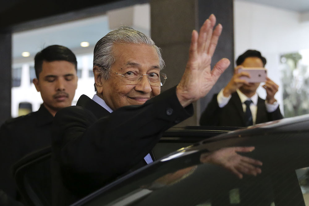 Prime Minister Tun Dr Mahathir Mohamad waves as he leaves Parliament in Kuala Lumpur August 2, 2018. u00e2u20acu201d Picture by Yusof Mat Isa