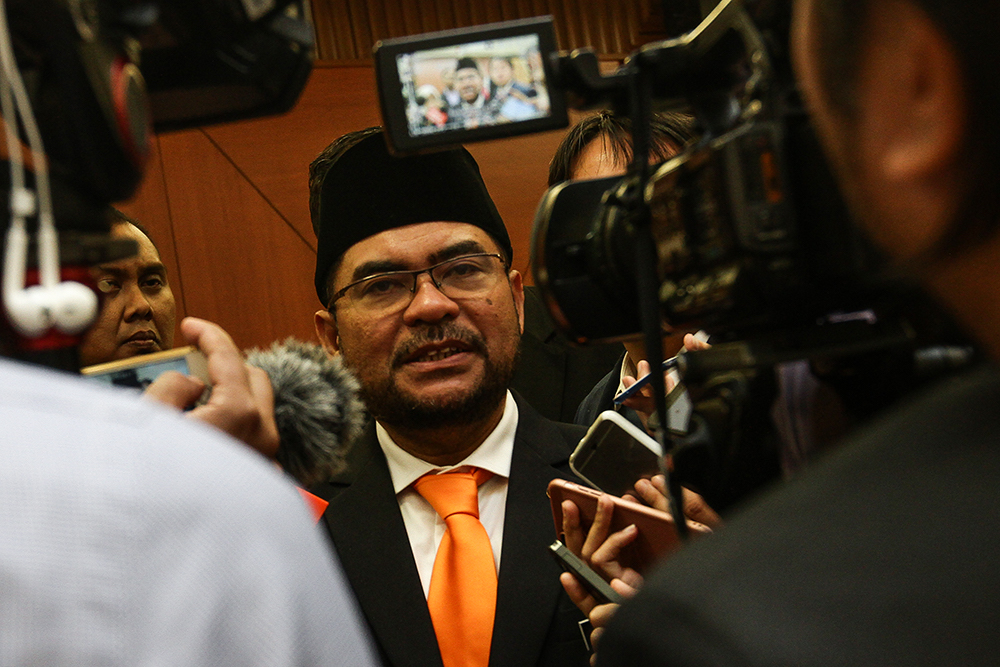 Minister in the Prime Ministeru00e2u20acu2122s Department in charge of Islamic Affairs Datuk Mujahid Yusof Rawa speaks to reporters at Parliament in Kuala Lumpur August 6, 2018. u00e2u20acu201d Picture by Miera Zulyana