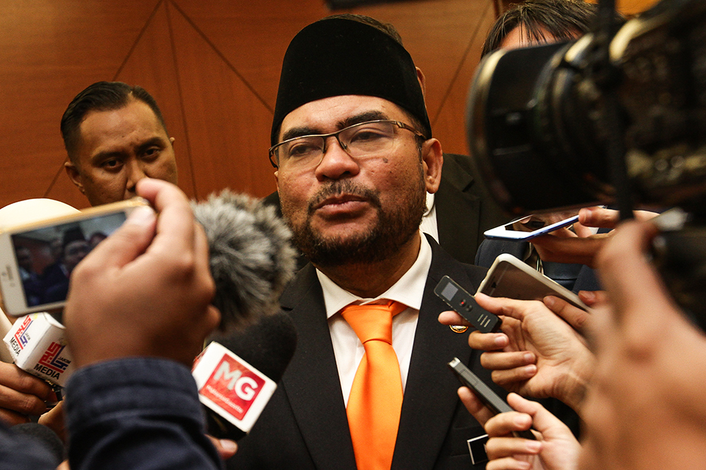 Minister in the Prime Ministeru00e2u20acu2122s Department in charge of Islamic Affairs Datuk Mujahid Yusof Rawa speaks to reporters at Parliament in Kuala Lumpur August 6, 2018. u00e2u20acu201d Picture by Miera Zulyana