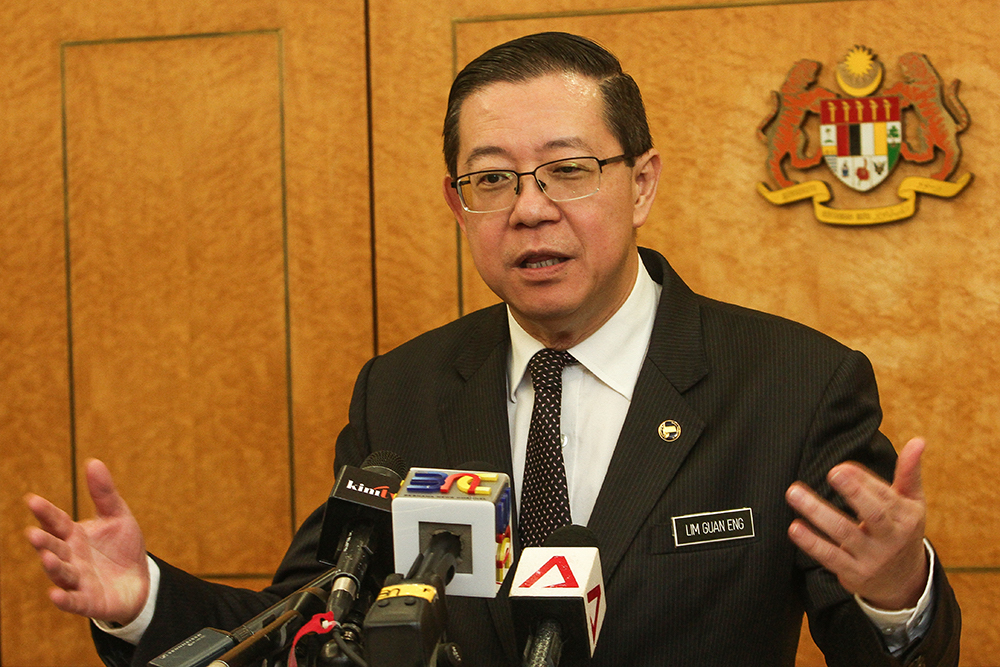 Lim Guan Eng speaks to reporters at Parliament in Kuala Lumpur August 6, 2018. u00e2u20acu201d Picture by Miera Zulyana
