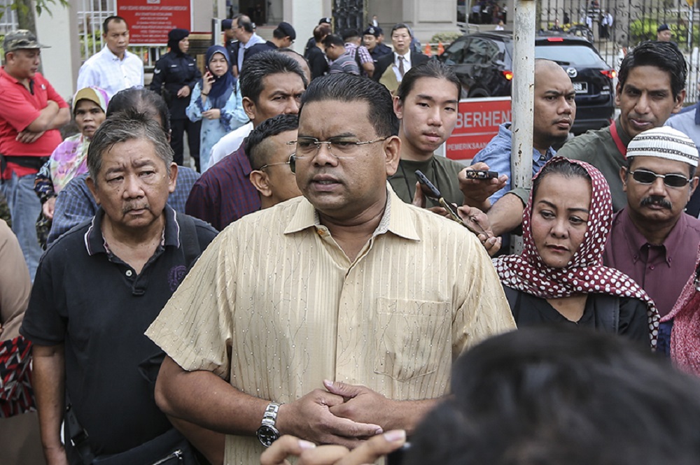 (From left) David Goh, Lokman Adam and Ellie Suriati address the media outside the Kuala Lumpur High Court August 8, 2018. u00e2u20acu201d Picture by Azneal Ishak