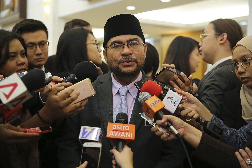 Minister in charge of Islamic affairs Datuk Mujahid Yusof Rawa speaks to reporters at the Parliament in Kuala Lumpur August 8, 2018. u00e2u20acu201d Picture by Yusof Mat Isa