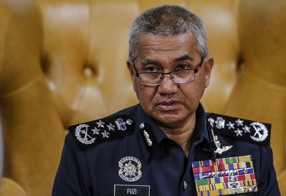 Inspector-General of Police Tan Sri Mohamad Fuzi Harun during a press conference at Bukit Aman in Kuala Lumpur August 14, 2018. u00e2u20acu201d Picture by Firdaus Latif