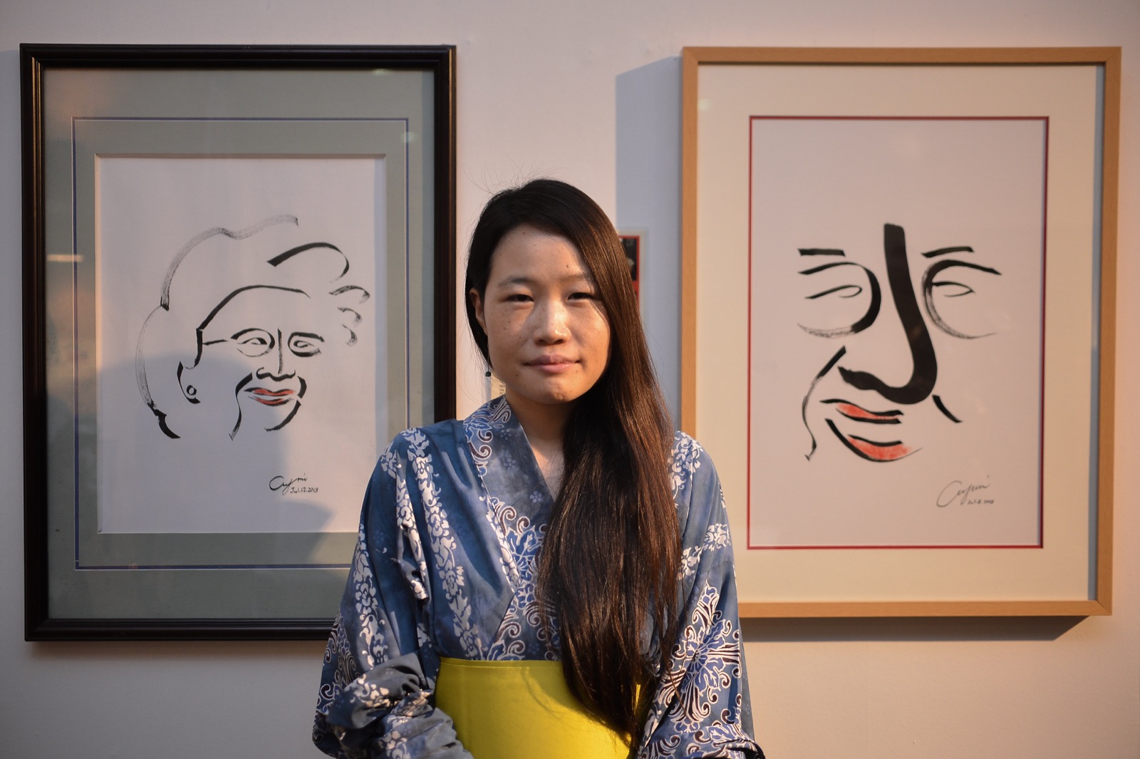 Artist Ayumi Imai from Japan poses with her artwork at  the ‘Tun M: A forever legacy’ art exhibition at Perdana University in Serdang, August 12, 2018.  