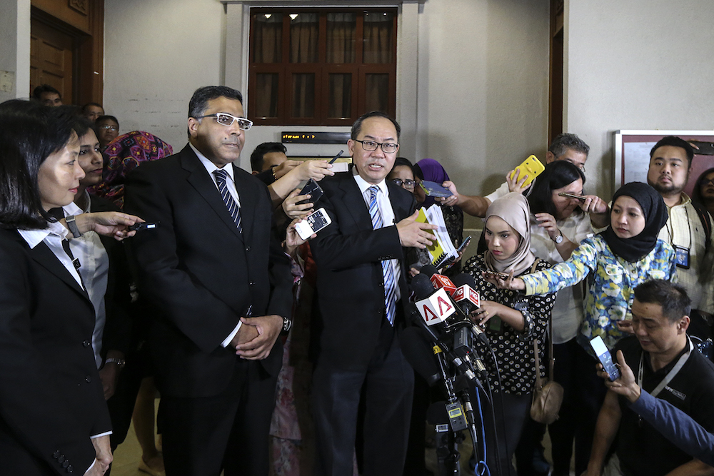 Lawyers Jeremy M. Joseph and Ong Chee Kwan speak to reporters at the Kuala Lumpur High Court August 24, 2018. u00e2u20acu201d Picture by Azneal Ishak