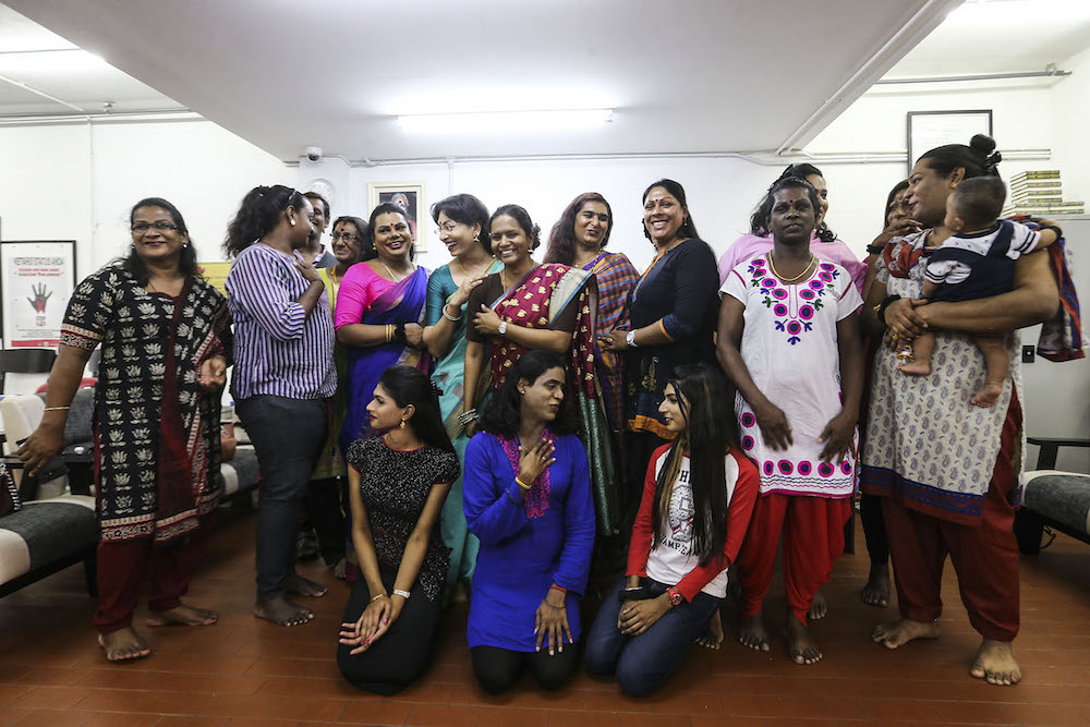 Founder PKKUM, Elisha Kor Krishnan, and transgender advocate Sharan Manthira Naidu pose for a group photo with Hindu trans women at a press conference in Kuala Lumpur August 24, 2018. u00e2u20acu201d Picture by Hari Anggara