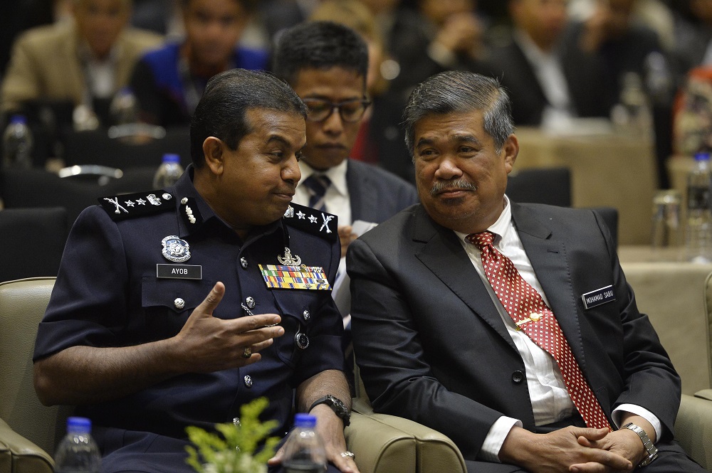 Federal Special Branch Counter Terrorism Division principal assistant director Deputy Commissioner Datuk Ayob Khan Mydin Pitchay (left) and Defence Minister Mohamad Sabu in Kuala Lumpur August 27, 2018. u00e2u20acu201d Picture by Azinuddin Ghazali