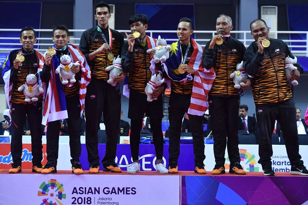 Malaysia's gold medallists pose for photographers during a victory ceremony for the men's regu sepak takraw at the 2018 Asian Games in Palembang August 28, 2018. u00e2u20acu201d AFP pic