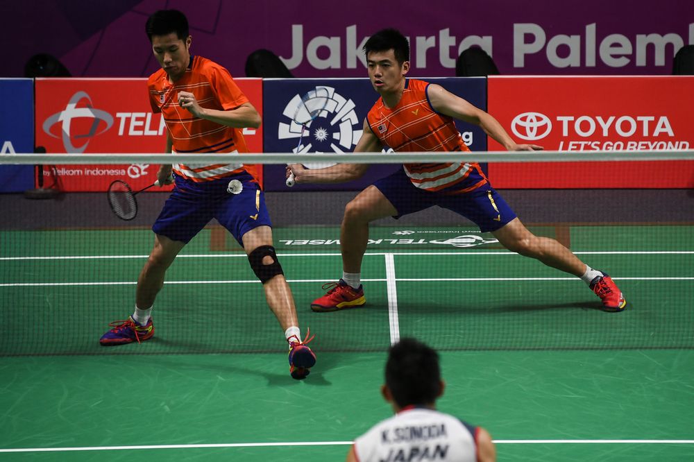 Malaysiau00e2u20acu2122s men doubles players Goh V Shem and Tan Wee Kiong in action against Japanu00e2u20acu2122s Takeshi Kamura and Keigo Sonoda at the 2018 Asian Games in Istora Senayan Stadium, Jakarta, August 19, 2018. u00e2u20acu201d Bernama pic