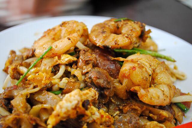 A plate of flat noodles cooked with sufficient 'wok hei' and topped with cockles and fresh prawns. — Picture courtesy of EatPlayEatPlay