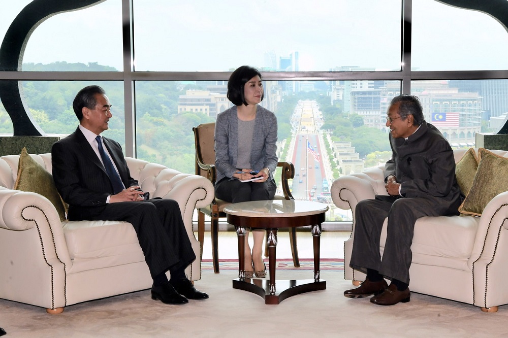 Prime Minister Tun Dr Mahathir Mohamad meets Chinau00e2u20acu2122s top diplomat Wang Yi (left) at his office in Putrajaya August 1, 2018. u00e2u20acu201d Bernama pic