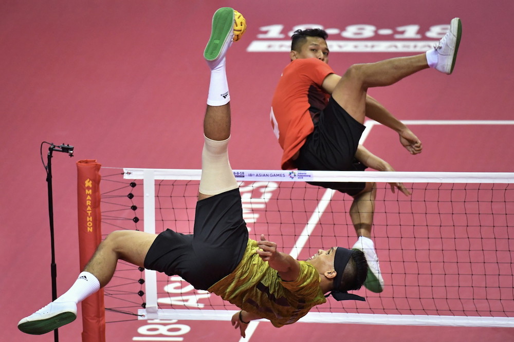 Malaysiau00e2u20acu2122s Muhamad Norhaffiz Abd Razak in action against Indonesia during the sepak takraw regu semi-finals at the 2018 Asian Games in Palembang August 21, 2018. u00e2u20acu201d Bernama pic
