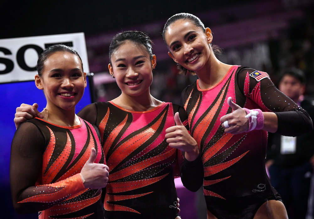 Tracie Ang, Tan Ing Yueh and Farah Ann Abdul Hadi celebrate after qualifying for the team event final at the 2018 Asian Games in Jakarta August 21, 2018. u00e2u20acu201d Bernama pic
