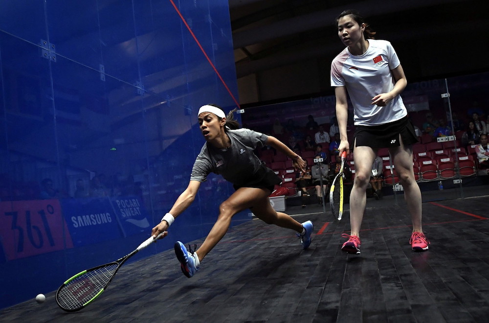 Datuk Nicol David in action against Li Dongjin of China during their second-round squash individual competition game at the 2018 Asian Games in Jakarta August 23, 2018. u00e2u20acu201d Bernama pic