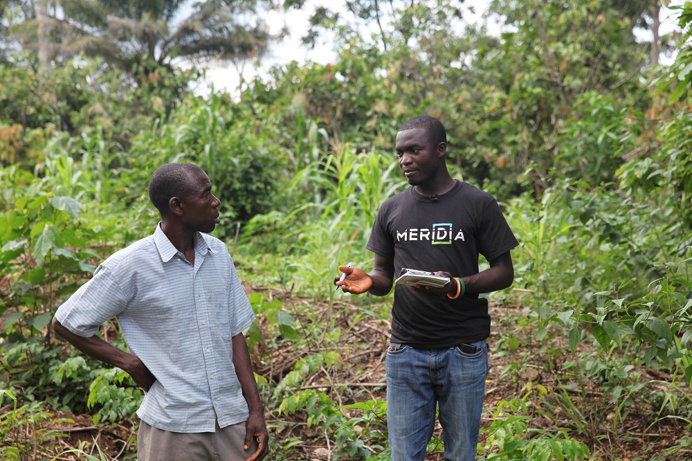 Meridia agent Shadrack Sraku maps a farmer's land in Nkwantanum, Ghana June 27, 2018. u00e2u20acu201d Thomson Reuters Foundation pic