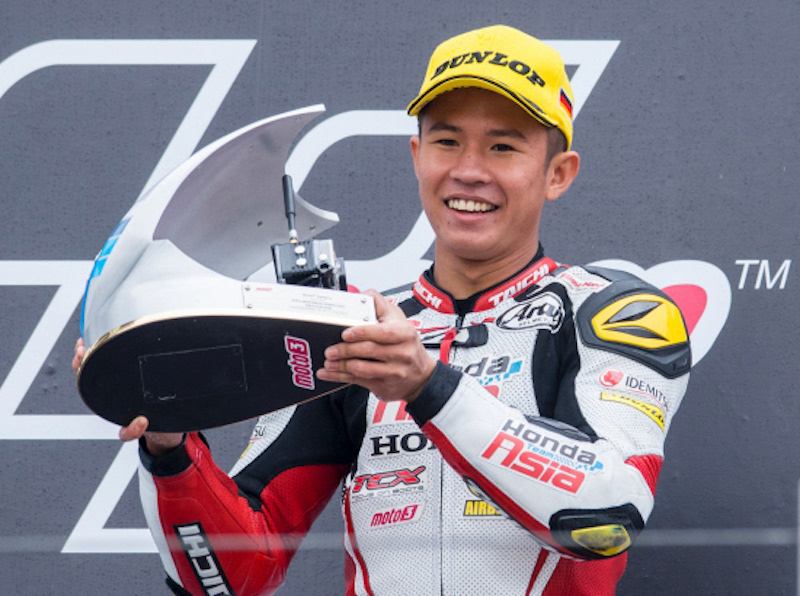 Khairul Idham Pawi celebrates on the podium after winning the Moto3 race of the Grand Prix of Germany at the Sachsenring Circuit in Hohenstein-Ernstthal July 17, 2016. u00e2u20acu201d AFP pic