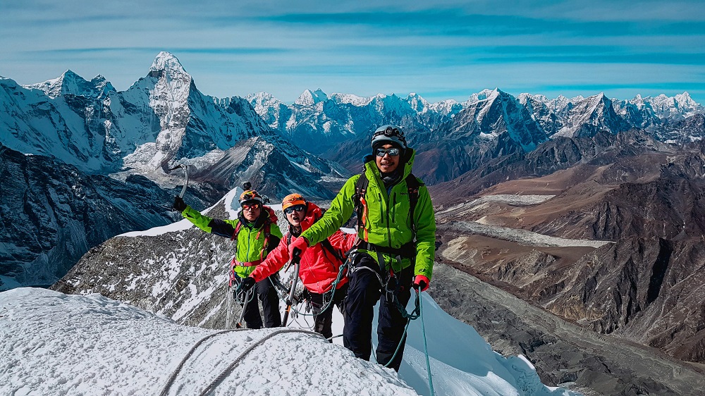 This handout photo released by the Hkakabo Razi Expedition 2018 on August 13, 2018 and taken on November 15, 2017 shows Myanmar mountaineers during their ascent of Ama Dablam mountain in Nepal. u00e2u20acu201d AFP pic  