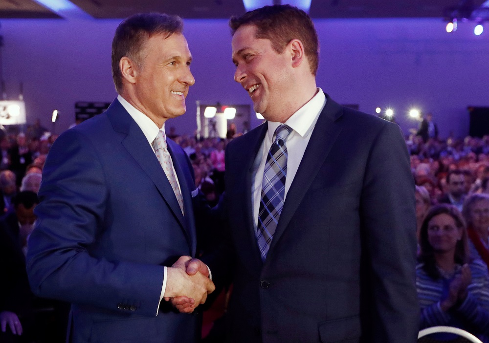 Maxime Bernier (left) speaks with Andrew Scheer after the first results are announced during the Conservative Party of Canada leadership convention in Toronto, Ontario, Canada, May 27, 2017. u00e2u20acu201d Reuters pic