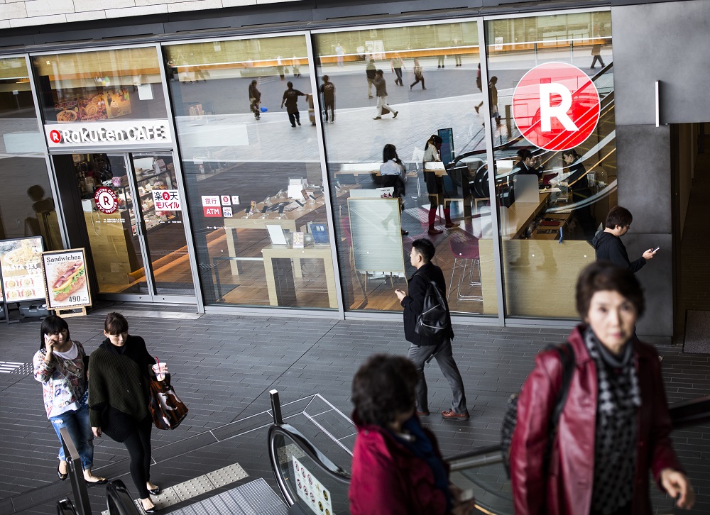 In this file photo taken on November 17, 2016, people walk past the logo of Japan's electronic commerce and internet firm Rakuten outside the company headquarters in Tokyo. u00e2u20acu201d AFP pic 