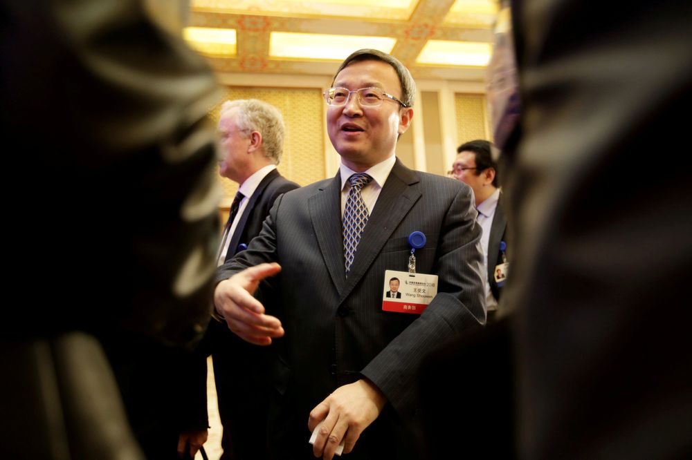 Chinese Vice Commerce Minister Wang Shouwen chats with participants after a speech at the annual session of China Development Forum 2018 at the Diaoyutai State Guesthouse in Beijing, March 25, 2018. u00e2u20acu201d Reuters pic