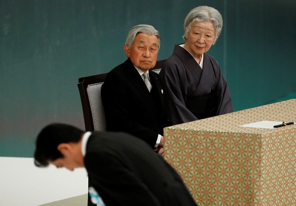 Japan's Emperor Akihito and Empress Michiko look at Prime Minister Shinzo Abe during a memorial ceremony marking the the 73rd anniversary of Japan's surrender in World War Two, at Budokan Hall in Tokyo, August 15, 2018. u00e2u20acu201d Reuters pic
