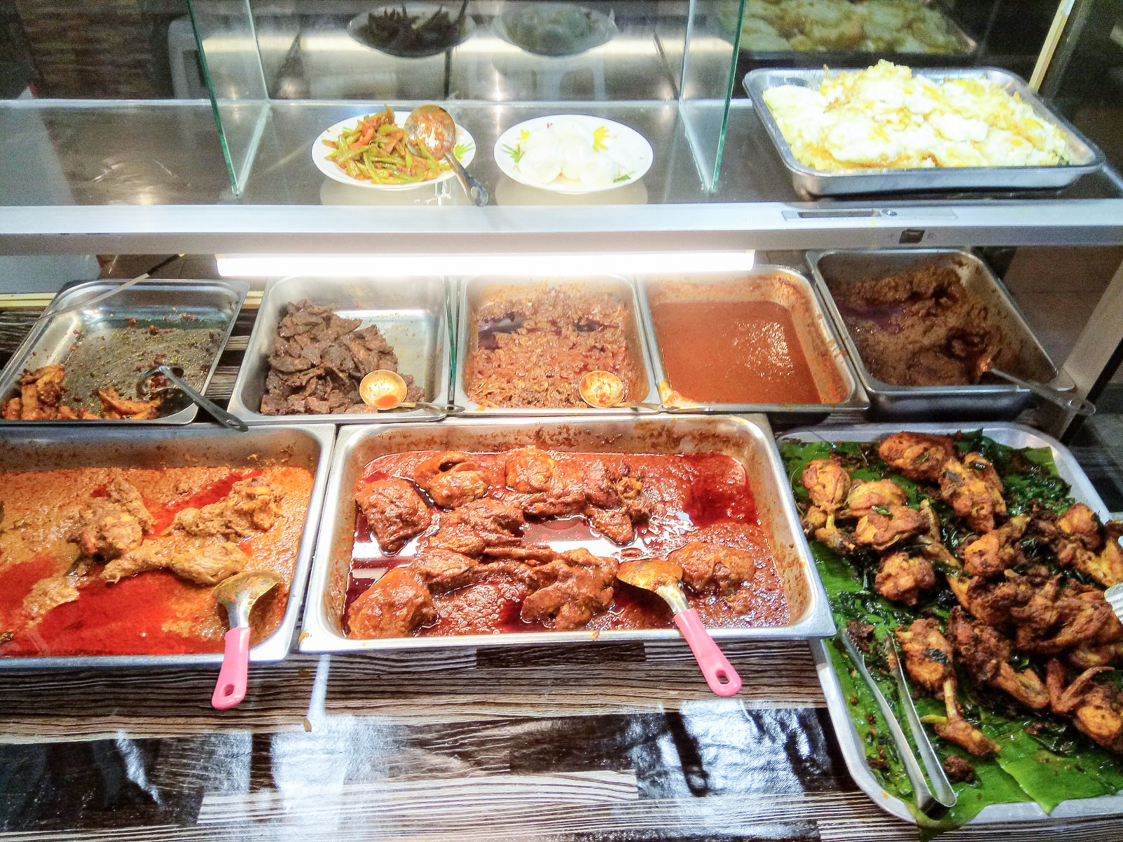 Enjoy your 'nasi lemak' with an array of accompanying dishes.
