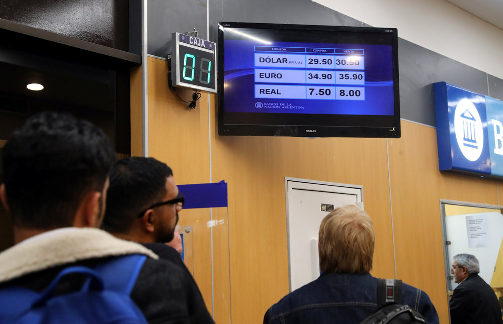 People line up to exchange currency outside a bank at Buenos Aires' metropolitan airport, Argentina August 13, 2018. u00e2u20acu201d Reuters pic