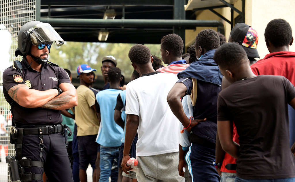 African immigrants wait in a row as they enter the immigrant center CETI in the Spanish enclave Ceuta, after some 200 refugees crossed the border fence between Morocco and Ceuta August 22, 2018. u00e2u20acu201d Reuters pic