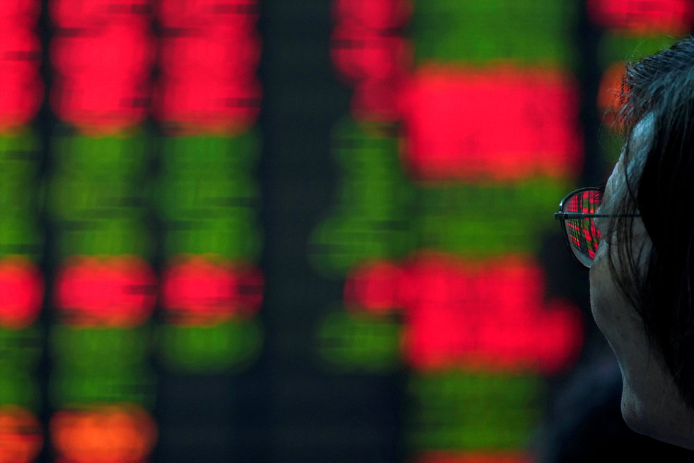 An investor looks at an electronic board showing stock information at a brokerage house in Shanghai July 6, 2018. u00e2u20acu201d Reuters pic