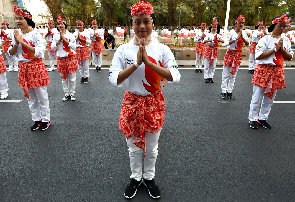 Indonesian dancers perform the traditional Poco-poco dance along the streets of Jakarta August 5, 2018. u00e2u20acu201d AFP pic