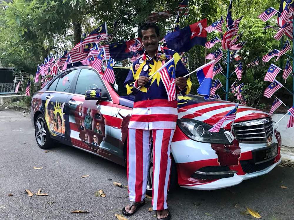 Businessman M. Kandapan poses with his Merdeka-themed Mercedes-Benz outside his home in Bandar Seri Alam in Masai. — Picture by Ben Tan
