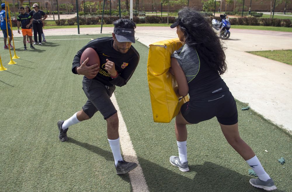 Coach Ichtar Zahraoui (right) trains a member of ,The Pirates, American football team in the Moroccan capital Rabat on July 29, 2018. u00e2u20acu201d AFP pic