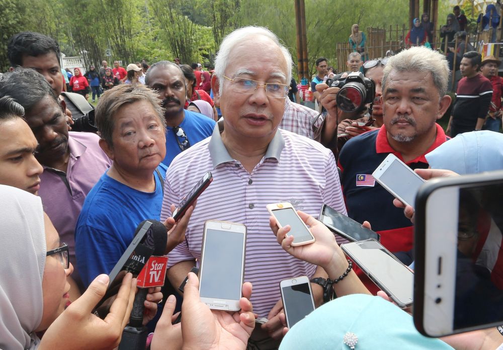 Najib speaks to reporters at the Perdana Botanical Gardens in Kuala Lumpur August 31, 2018. u00e2u20acu201d Picture by Razak Ghazali