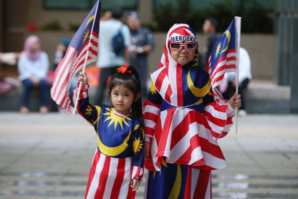 Children clad in the u00e2u20acu02dcJalur Gemilangu00e2u20acu2122 are pictured at Dataran Putrajaya August 31, 2018. u00e2u20acu201d Picture by Azinuddin Ghazali
