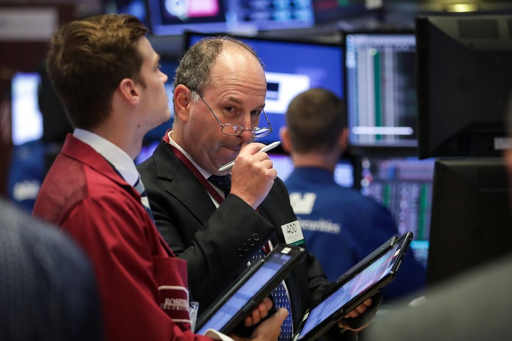 Traders and financial professionals work on the floor of the New York Stock Exchange (NYSE) at the opening bell, August 2, 2018 in New York City. u00e2u20acu201d AFP pic