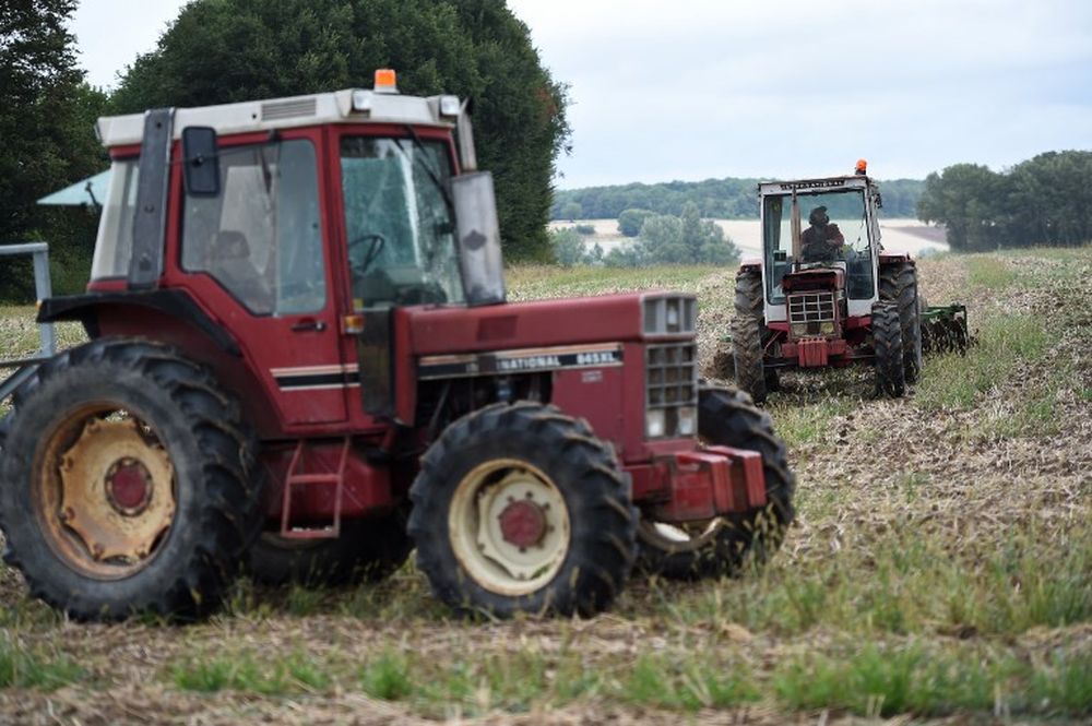 Members of French farmers union drive tractors through a field as they occupy fields belonging to Chinese farmers, to demonstrate against u00e2u20acu02dcland grabbingu00e2u20acu2122 by Chinese investors, near Chatillon-sur-Indre, August 29, 2018. u00e2u20acu201d AFP pic