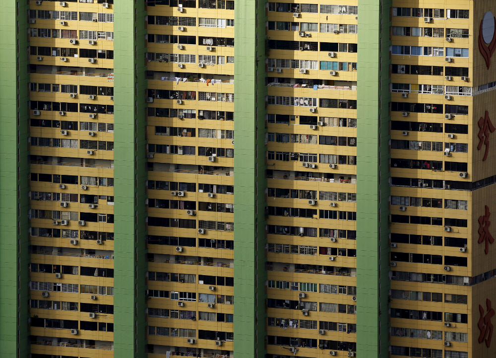Air-conditioning units dot the facade of the Peopleu00e2u20acu2122s Park Complex residential apartment in Singaporeu00e2u20acu2122s Chinatown February 29, 2016. u00e2u20acu201d Reuters pic
