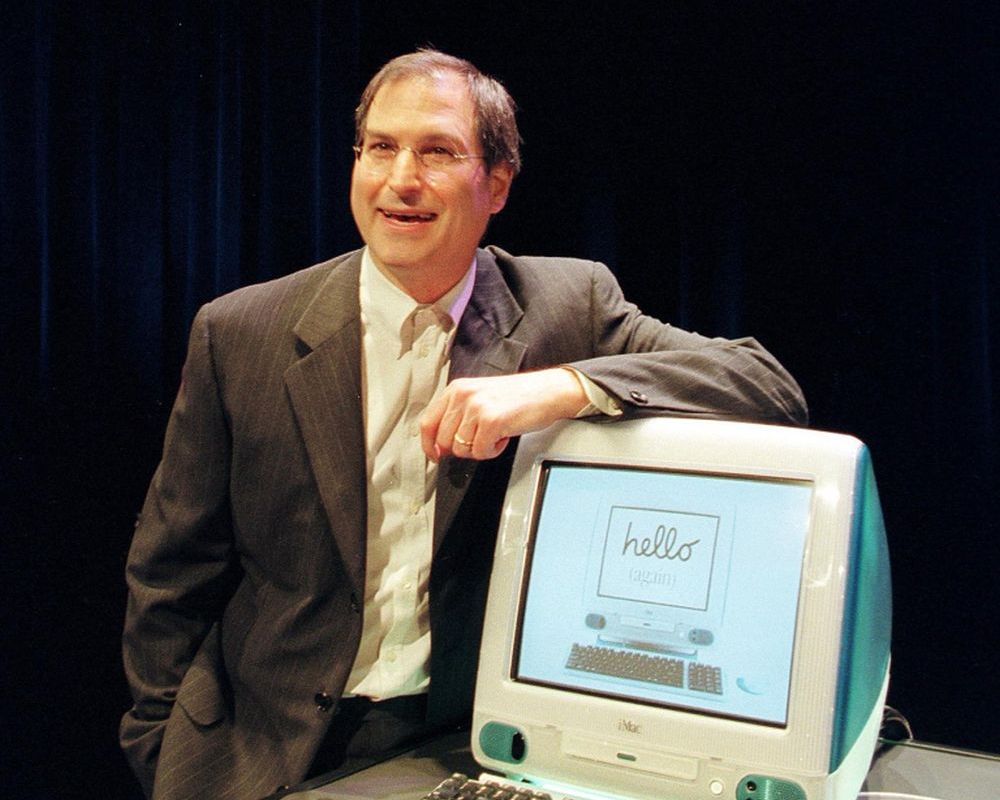 Steve Jobs posing with the first iMac in 1998. u00e2u20acu2022 AFP pic