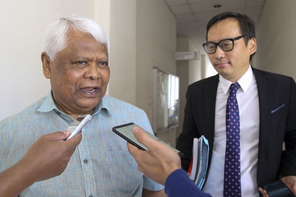 Datuk Tamrin Ghafar (left) speaks to reporters outside the courtroom at the Petaling Jaya Sessions Court, August 29, 2018. u00e2u20acu2022 Picture by Yusof Mat Isa