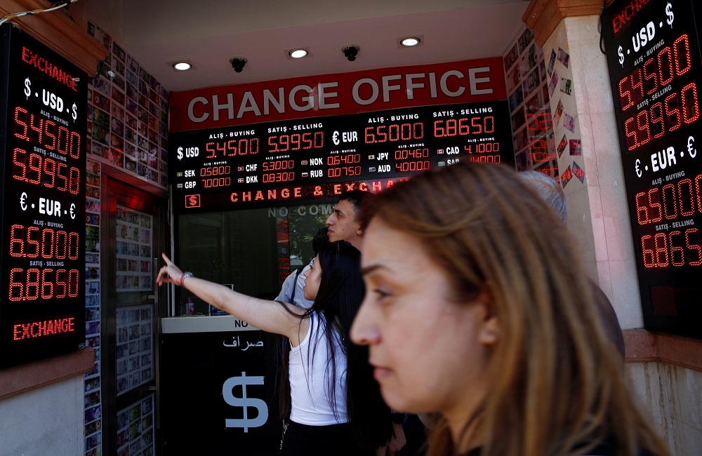 People check currency exchange rates at a currency exchange office in Istanbul, Turkey August 10, 2018. u00e2u20acu201d Reuters pic