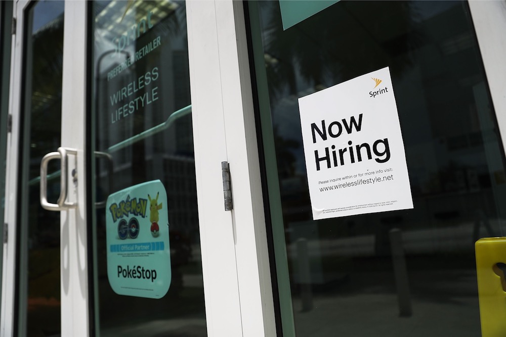 This file photo taken on July 7, 2017 shows a now hiring sign in a window of a business in Miami. u00e2u20acu201d AFP pic 