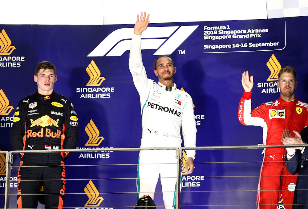 Mercedesu00e2u20acu2122 Lewis Hamilton celebrates after winning the Singapore Grand Prix September 16, 2018, alongside second placed Red Bullu00e2u20acu2122s Max Verstappen and third placed Ferrariu00e2u20acu2122s Sebastian Vettel. u00e2u20acu201d Reuters pic
